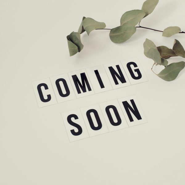 pexels-photo-4439444-4439444 Eucalyptus branch with 'Coming Soon' message on white background for announcements.